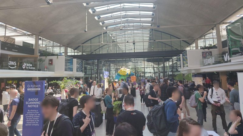 The exposition floor at Station F filled with conference attendees during a break between sessions